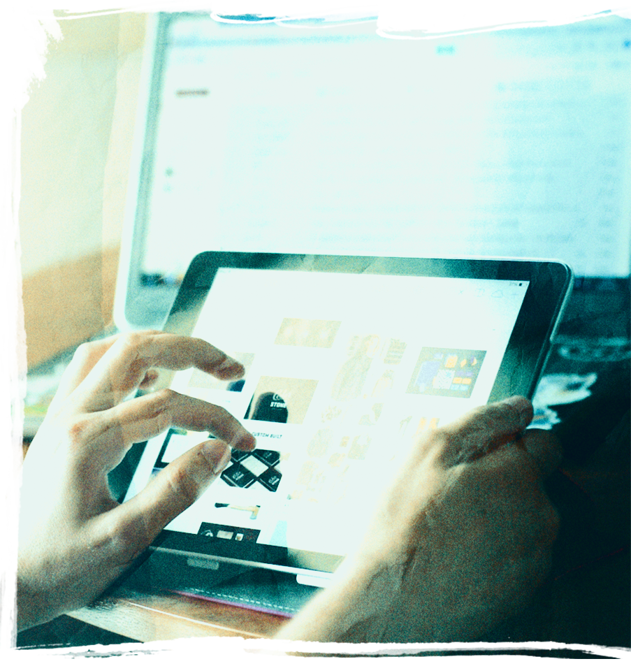 Man using a tabley to zoom in on a product
